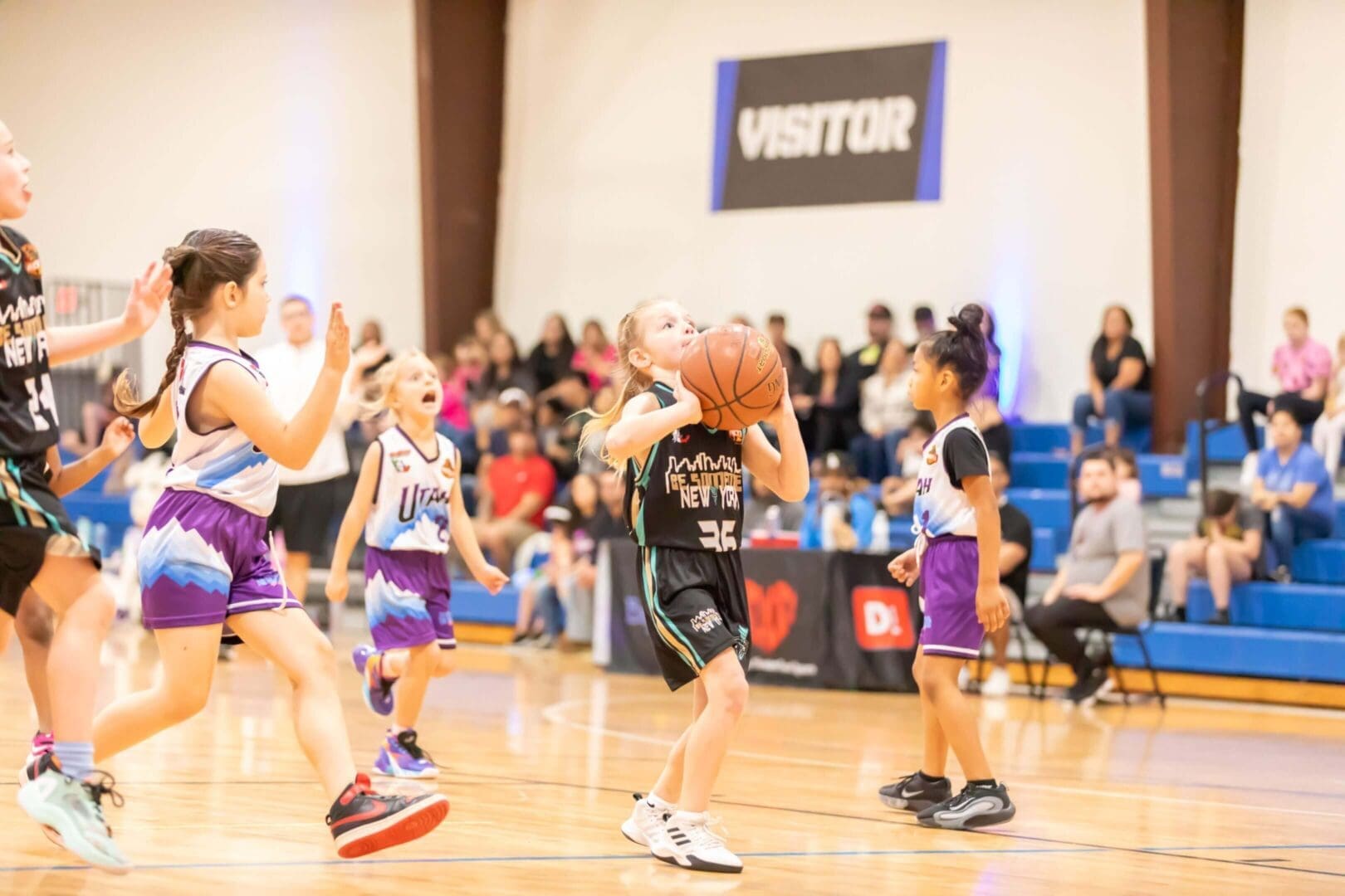 Girls playing basketball in a gym
